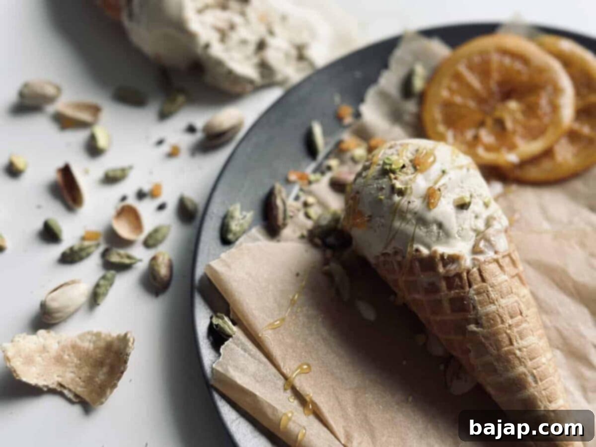 Exquisite pistachio and cardamom ice cream garnished with candied orange slices.