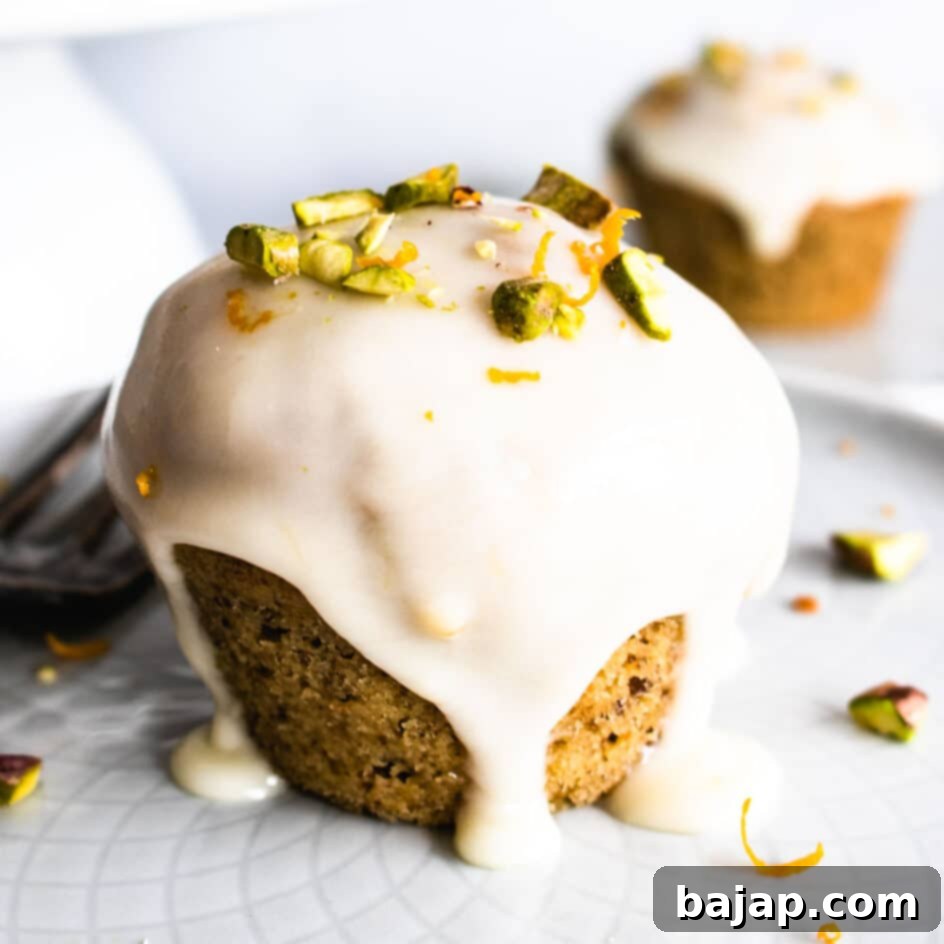 Cute vegan orange and pistachio cakes, bursting with citrus and nutty flavors.
