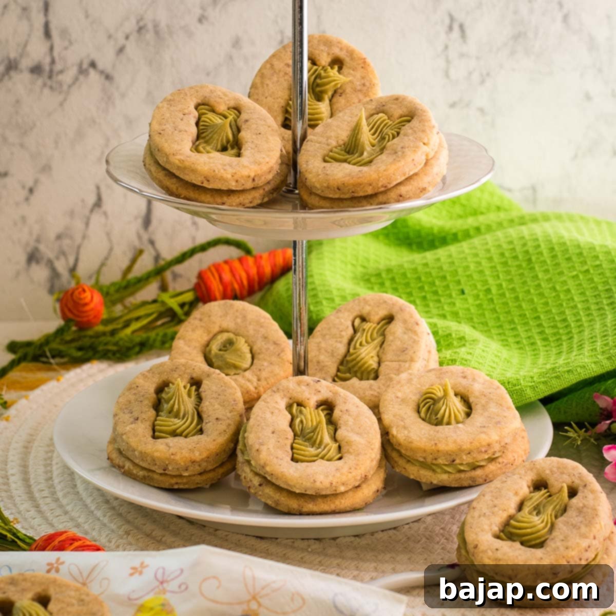 Egg-free cut-out cookies topped with rich pistachio ganache, a perfect treat for celebrations.