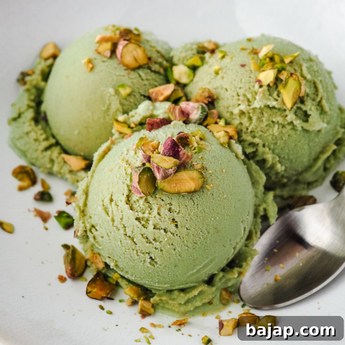Creamy homemade pistachio ice cream with a natural green hue and rich nutty flavor.