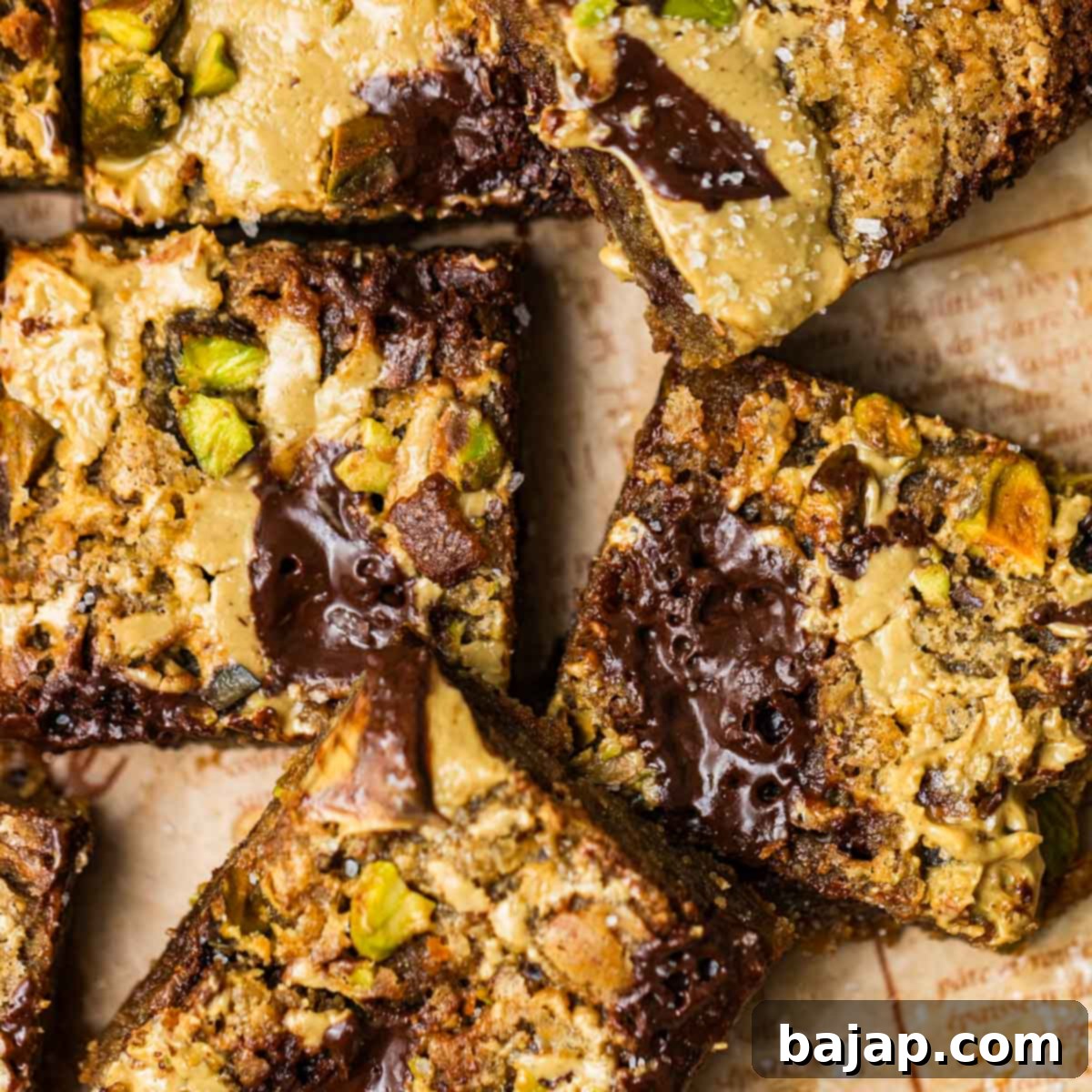 Chewy brown butter pistachio blondies with chocolate chunks.