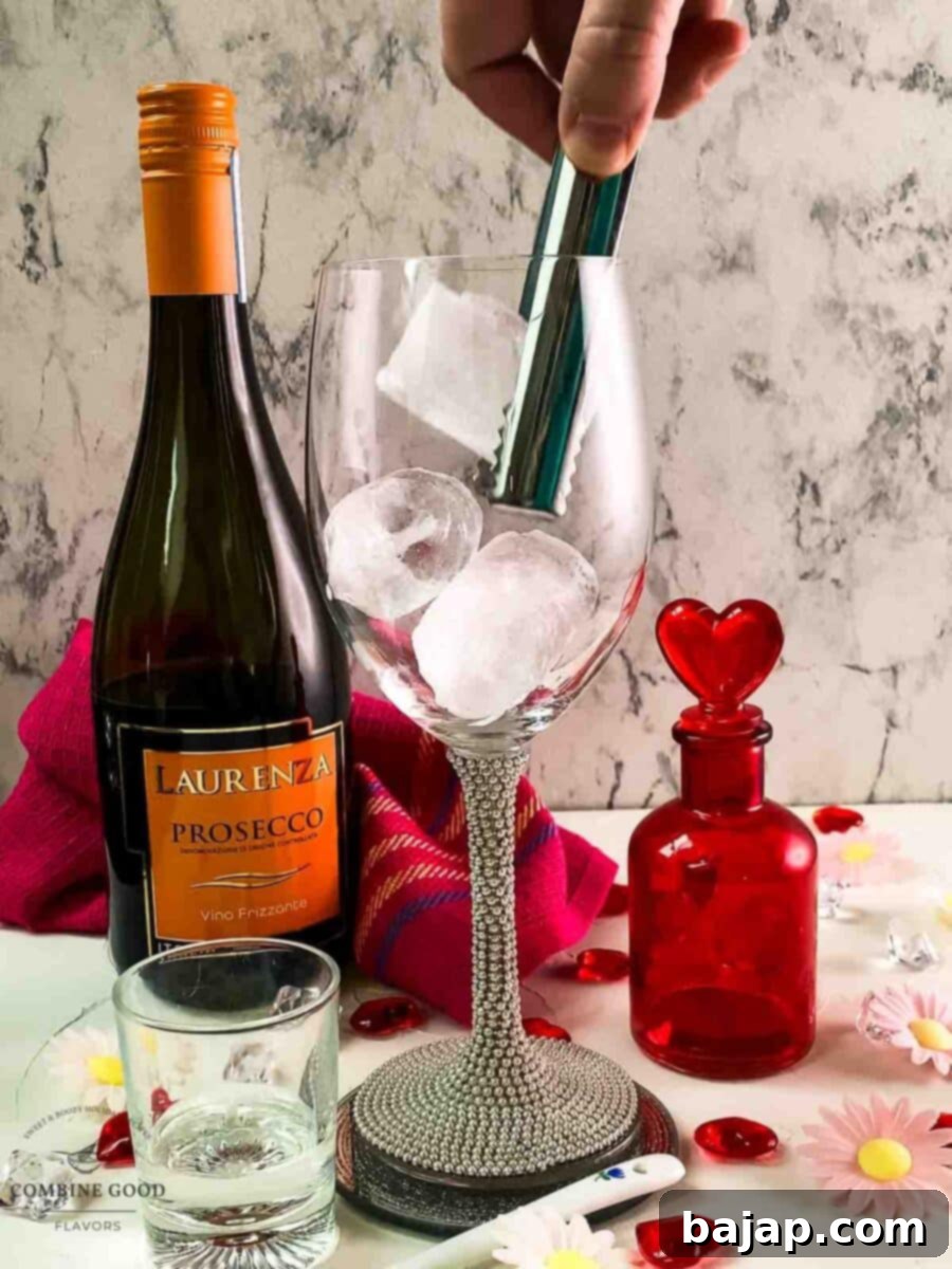 Add cubed ice to the wine glass.