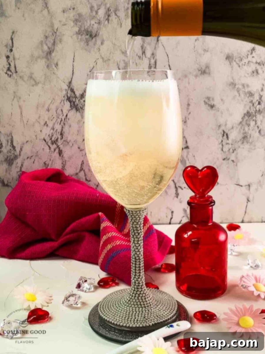 Top the gin filled glass with prosecco.