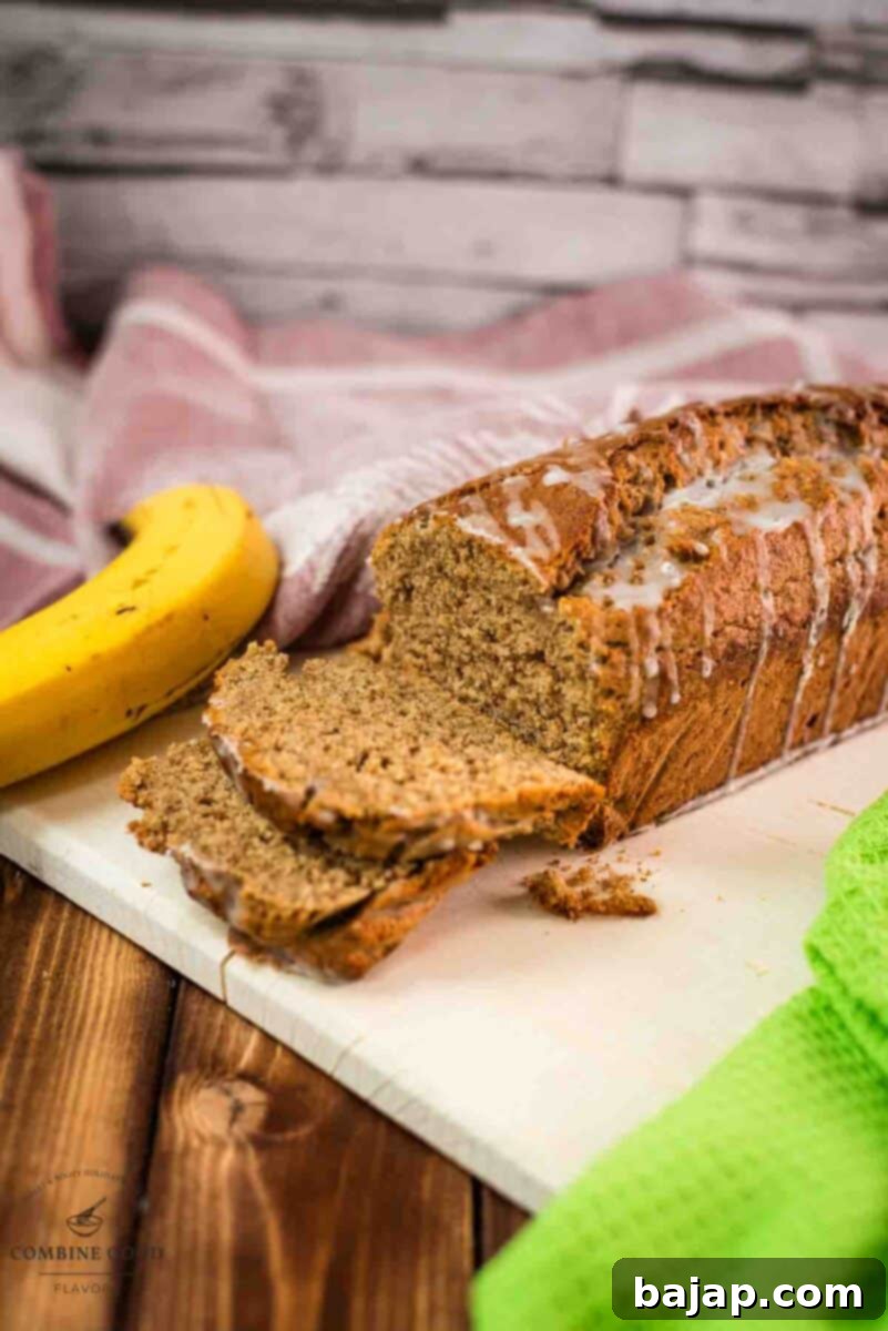Delicious low sugar banana loaf bread, with light sugar glaze drizzled over the banana bread.