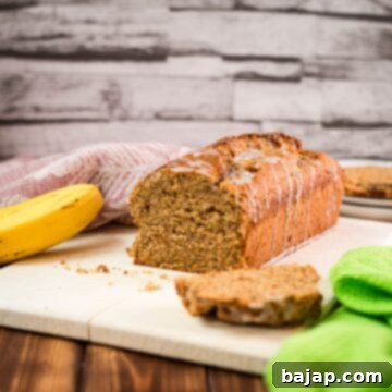 Delicious low sugar banana loaf bread, with light sugar glaze drizzled over the banana bread.