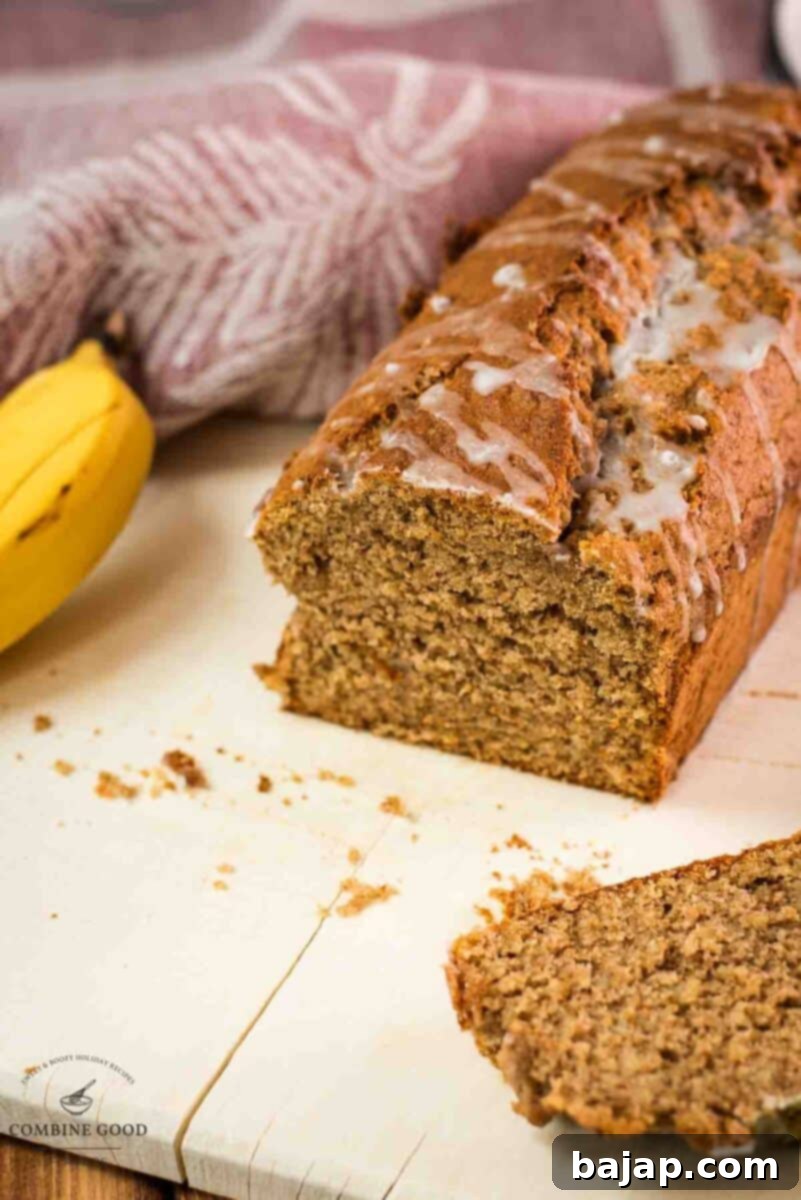 Delicious low sugar banana loaf bread, with light sugar glaze drizzled over the banana bread.