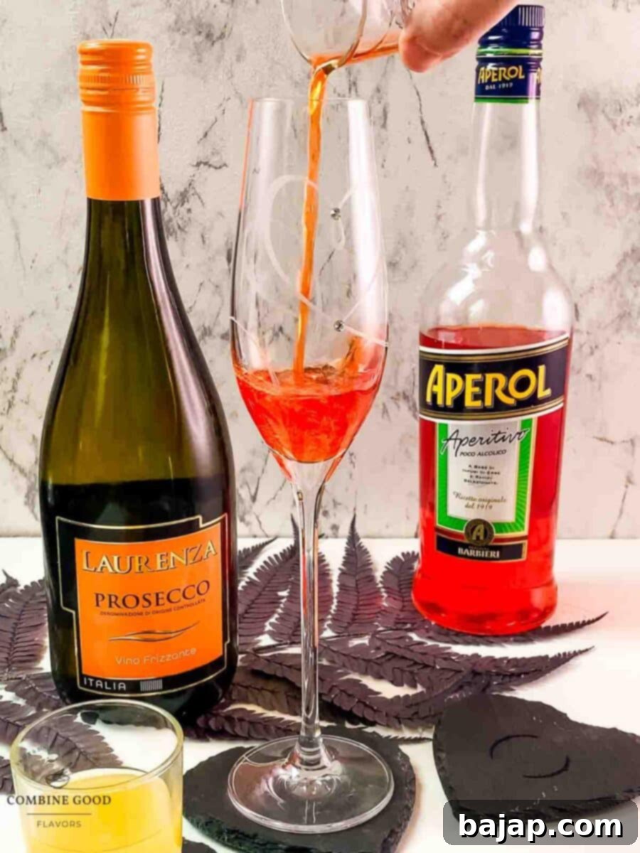 Add Aperol to the champagne glass.