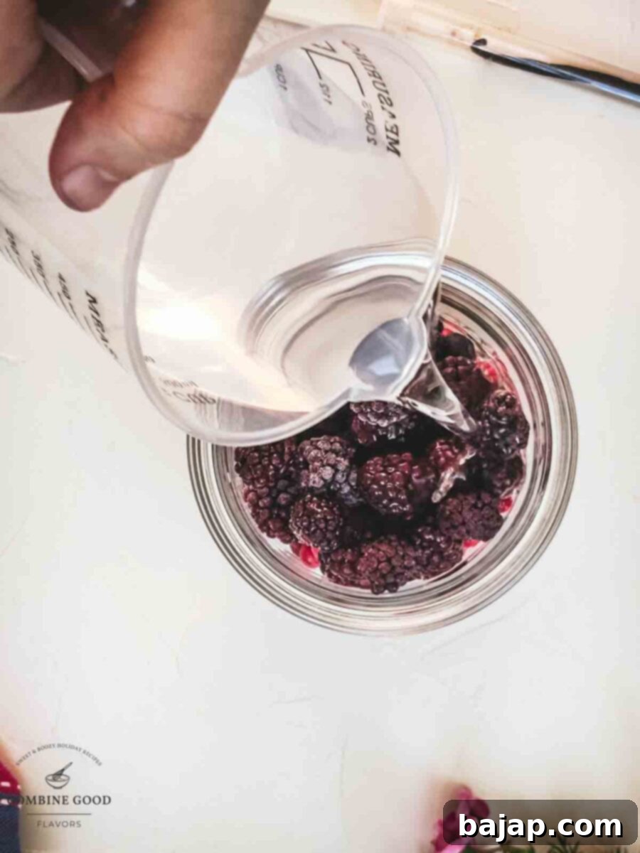 Pour vodka to the berry mix.
