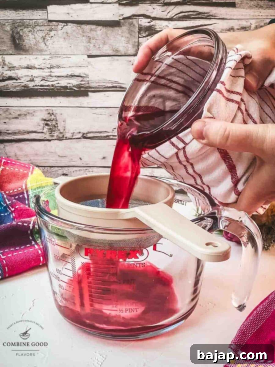 Pour the vodka berry mix through a sieve into a jug.