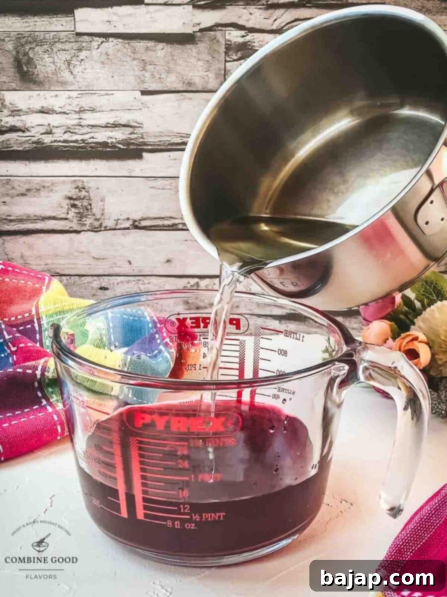 Pour the simple syrup into the jug with the berry infused vodka.