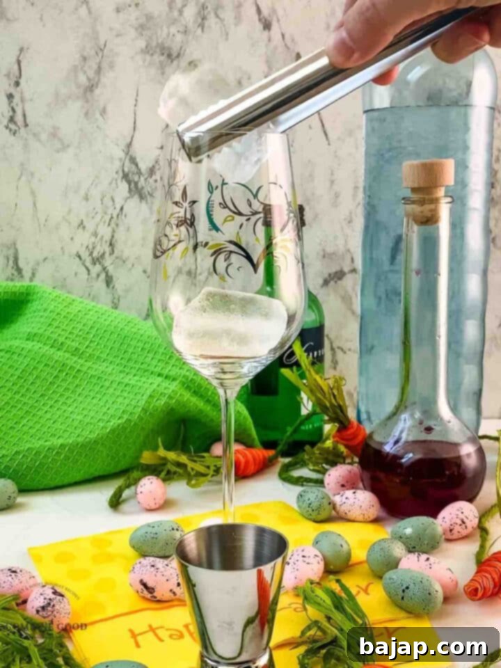 Add cubed ice to the white wine glass.