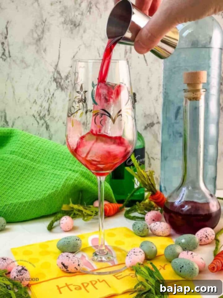 Add your homemade Chambord to the cubed ice filled white wine glass.
