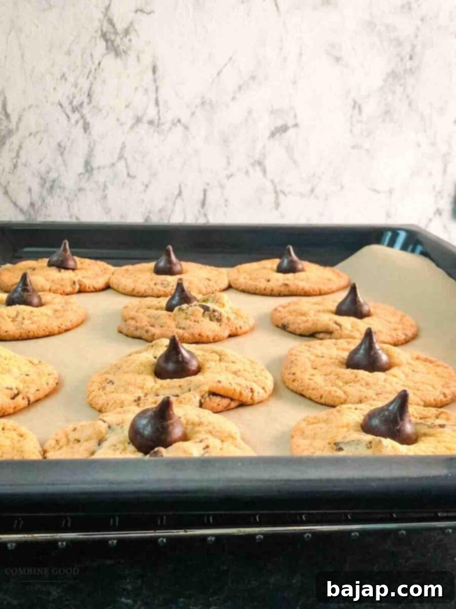 Finished assembled Hershey's special dark chocolate chip cookies on baking sheet.