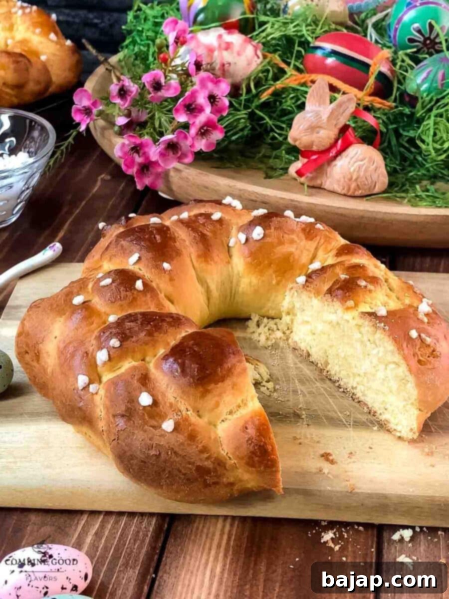 Another view of the gorgeous braided Easter bread wreath, on a wooden cutting board with Easter decor.