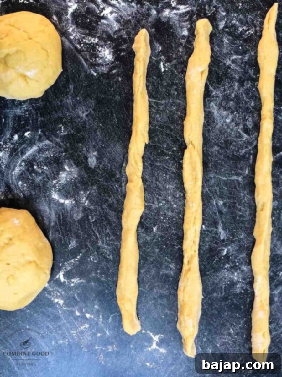 Roll each dough piece into 30 cm (11.8 inch) strands for braiding.