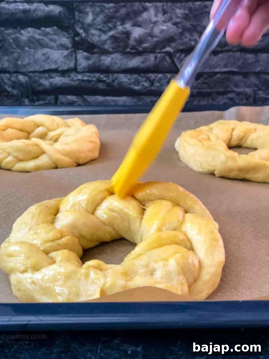 Brush the Easter bread wreaths with egg wash before baking for a golden crust.