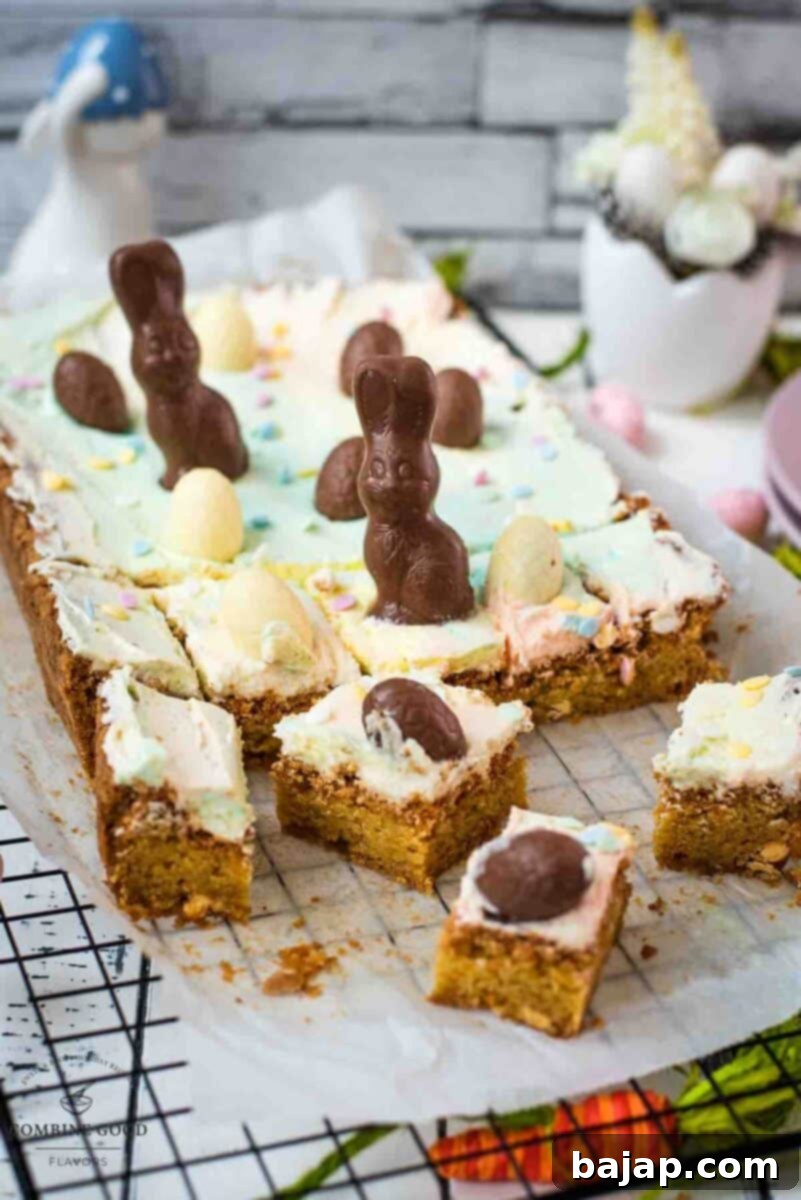 Sliced and decorated Easter Funfetti sugar cookie bars with pastel marbled buttercream and chocolate decorations.
