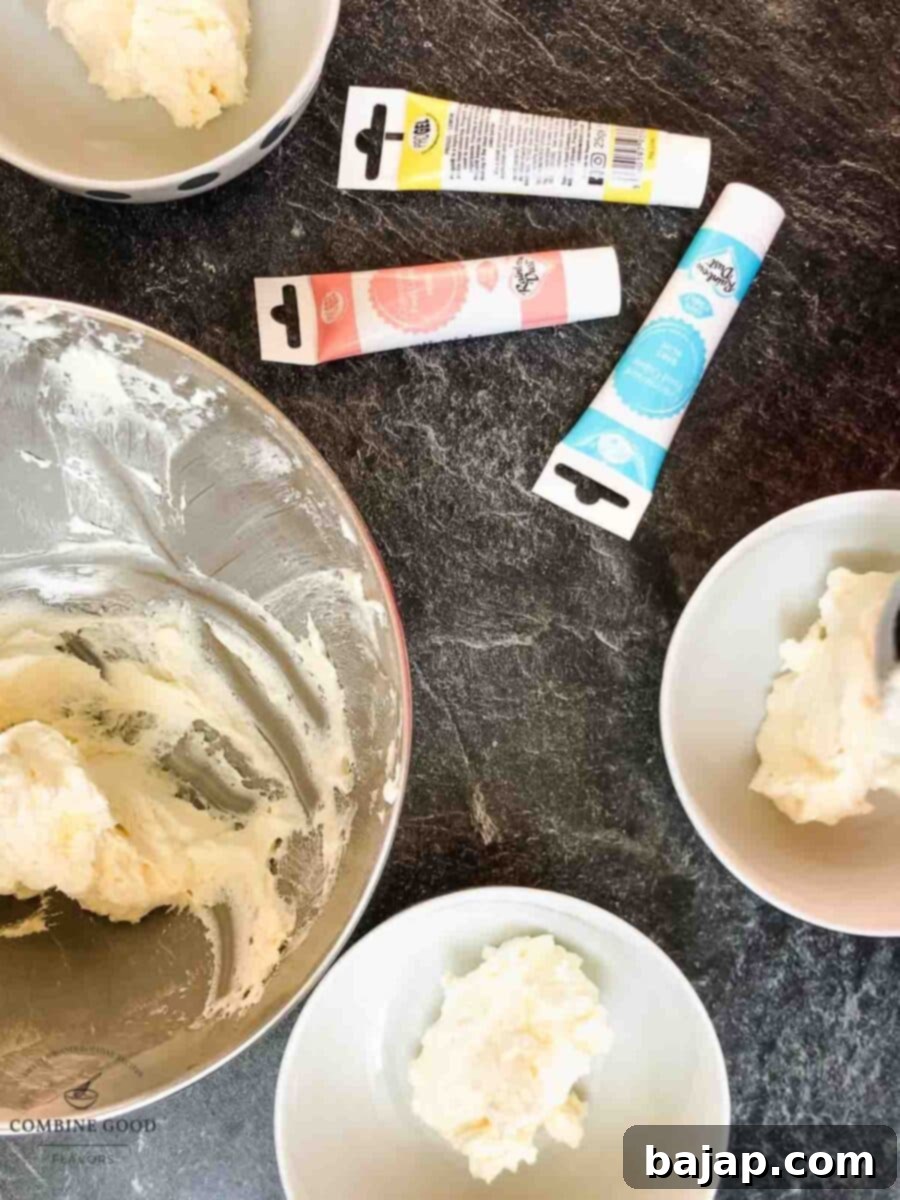 Dividing white buttercream into separate bowls for coloring.