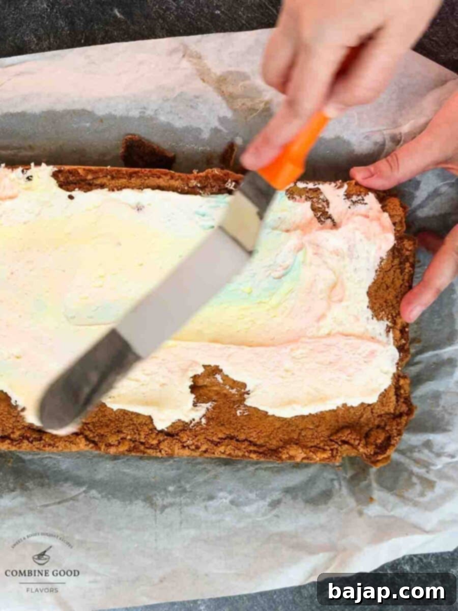 Gently swirling pastel buttercream over Funfetti cookie bars to create a stunning marbled frosting effect.