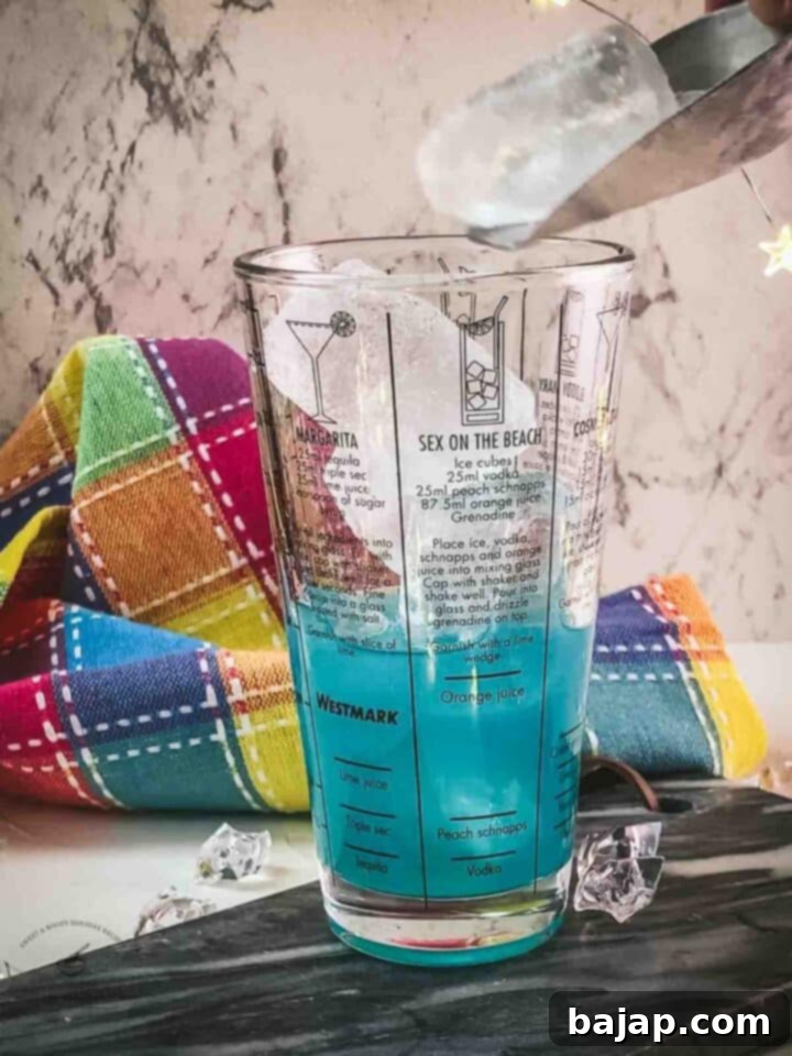 Fill the cocktail shaker with cubed ice.