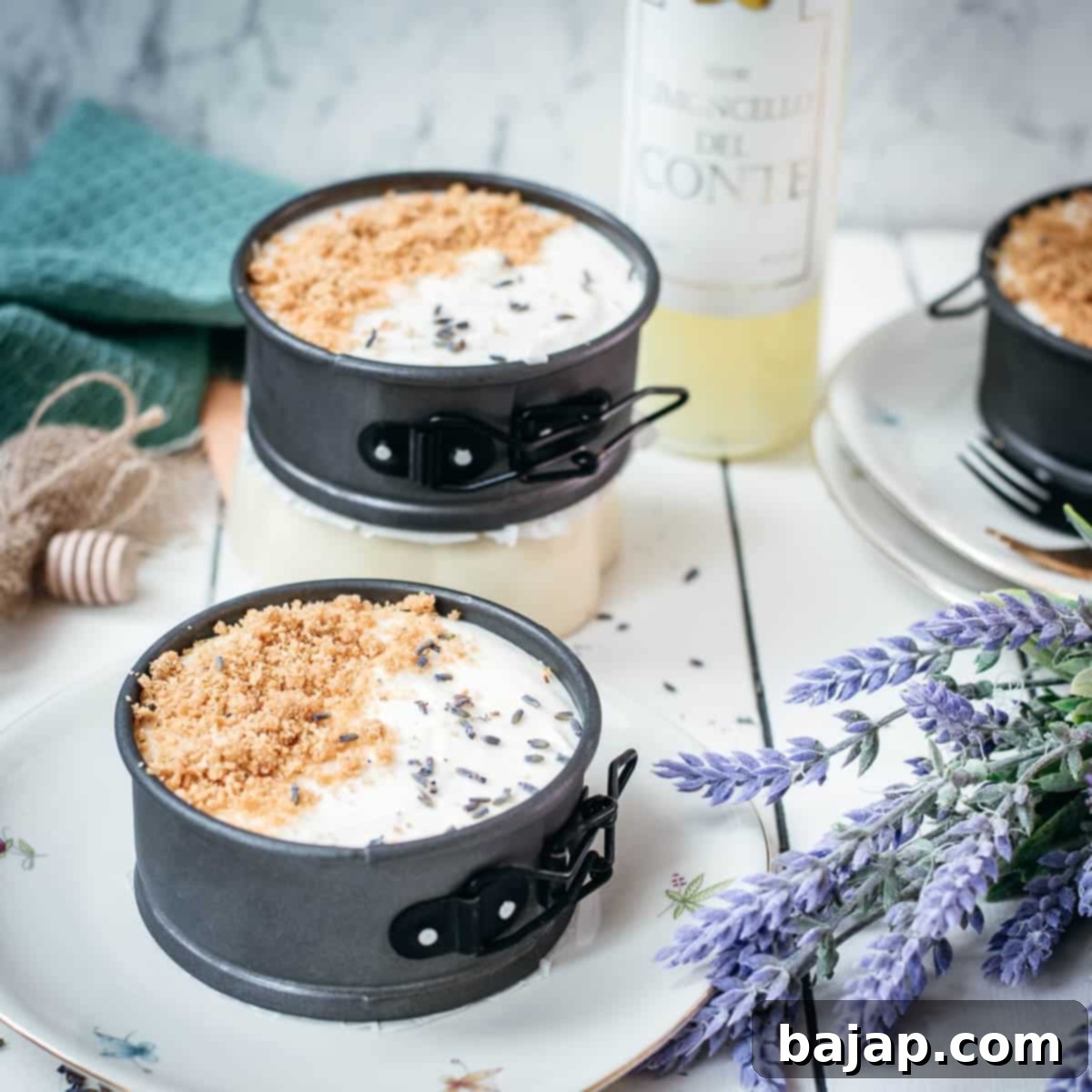Adorable mini no bake cheesecakes with lavender and limoncello, placed on plates with a floral pattern.