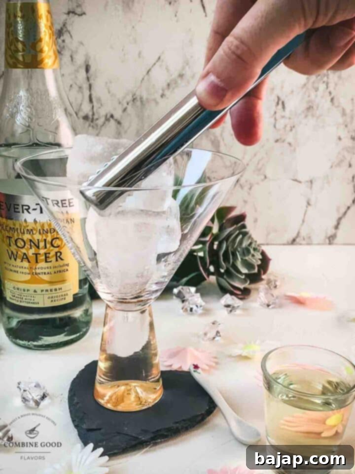 Add cubed ice to the cocktail glass.