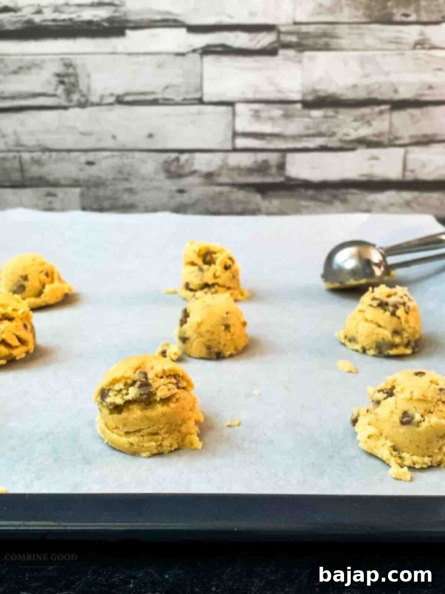 Scoop tablespoon-sized portions of dough onto the prepared baking sheet.