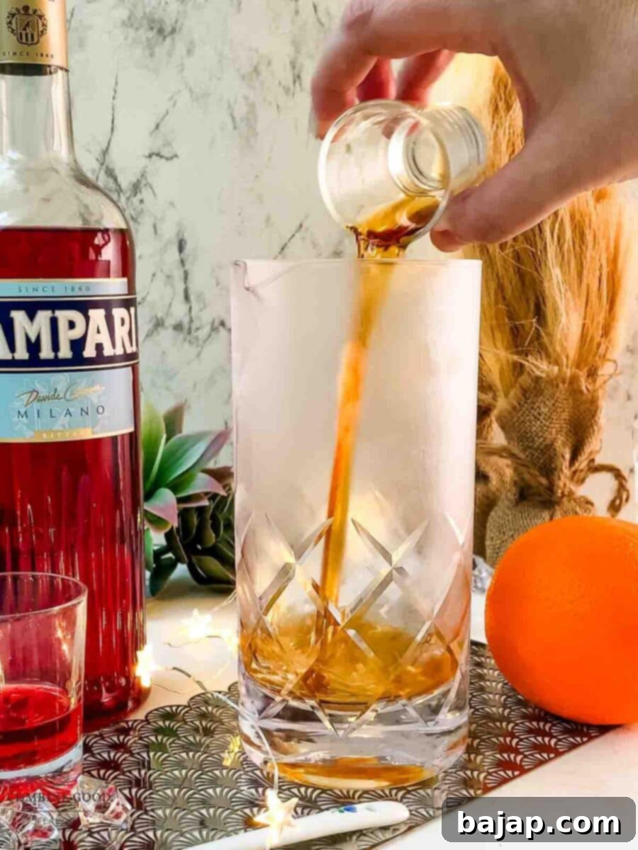 Add sweet vermouth to the stirring glass.
