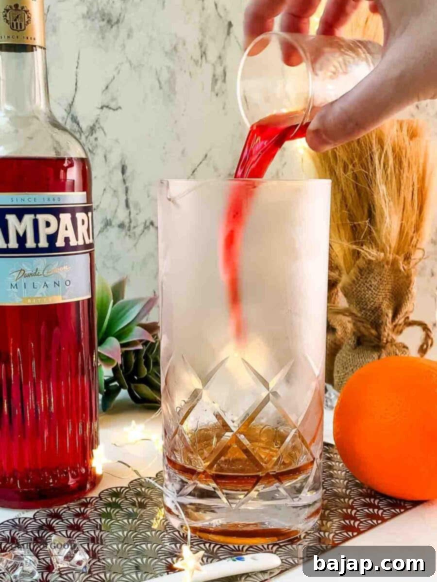 Add Campari to the stirring glass.
