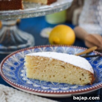 Delicious limoncello ricotta cake slice on a cute blute white colored plate.