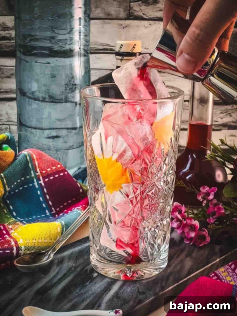Pour in the vibrant blackberry raspberry liqueur, adding rich berry flavor and color.