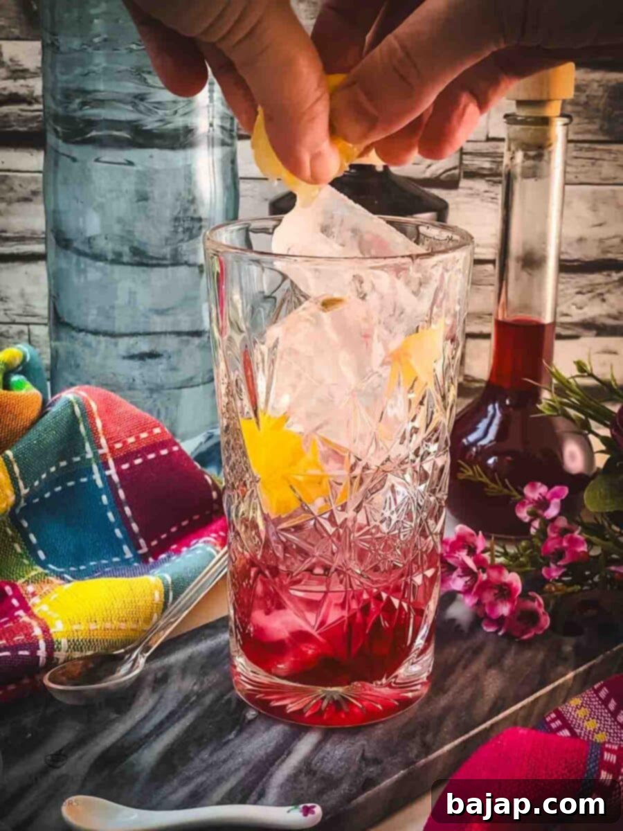 Squeeze a small amount of lemon juice into the glass, adding a final bright touch.