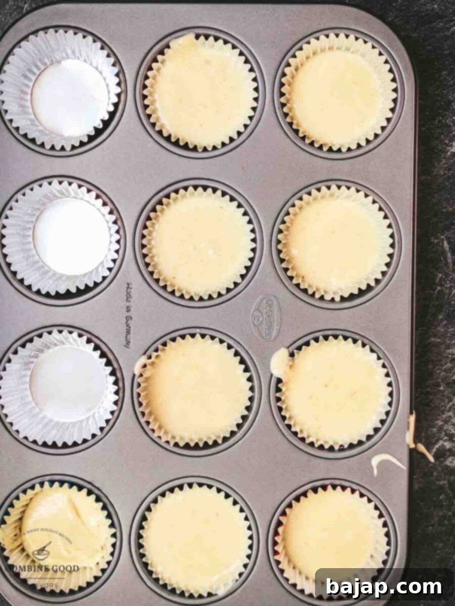Muffin dough filled muffin cups.