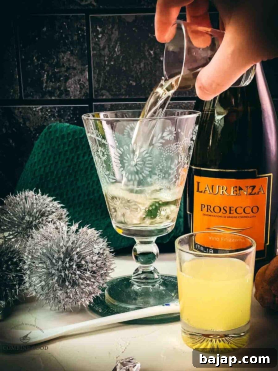 Adding white vermouth to the serving glass for the Blondie cocktail.