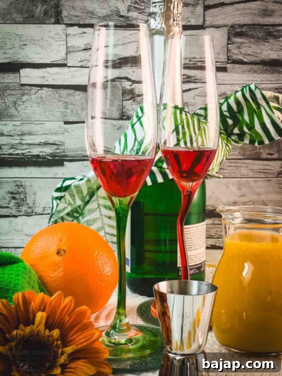 Pouring Campari Milano into a champagne glass, forming the base of the mimosa.