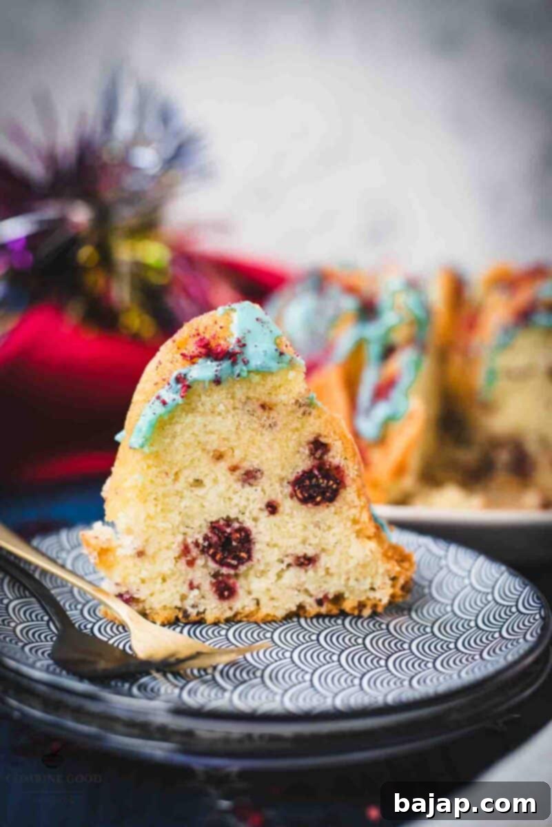 Slice of firecracker bundt cake. Placed on white blue plates.