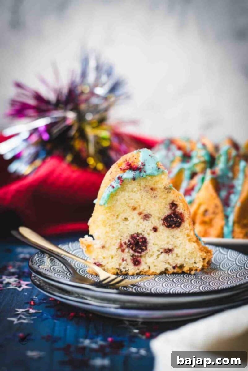 Slice of firecracker bundt cake. Placed on white blue plates.