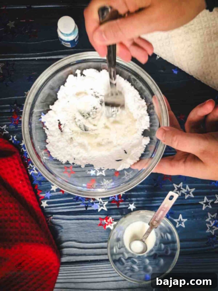 Add milk to the powdered sugar.