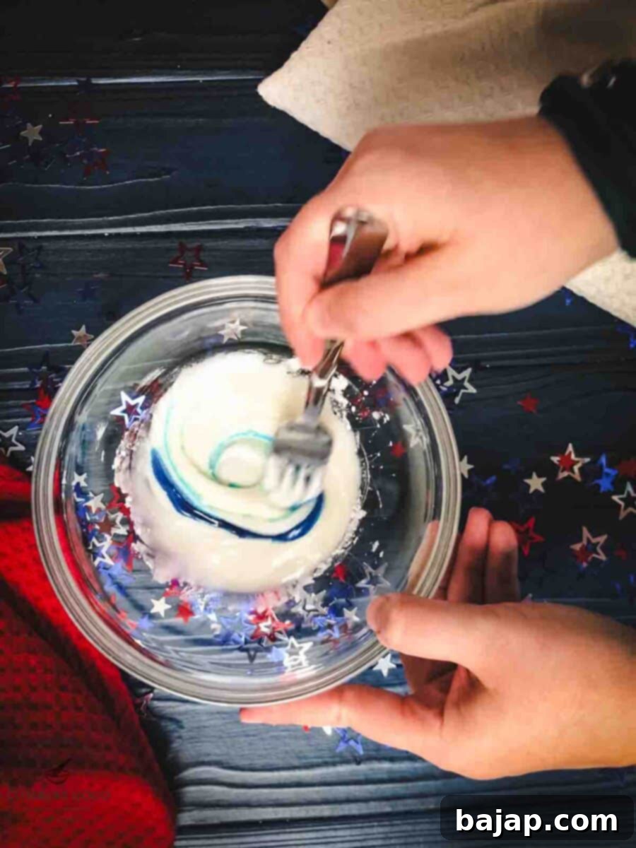 Mix in the blue food coloring.