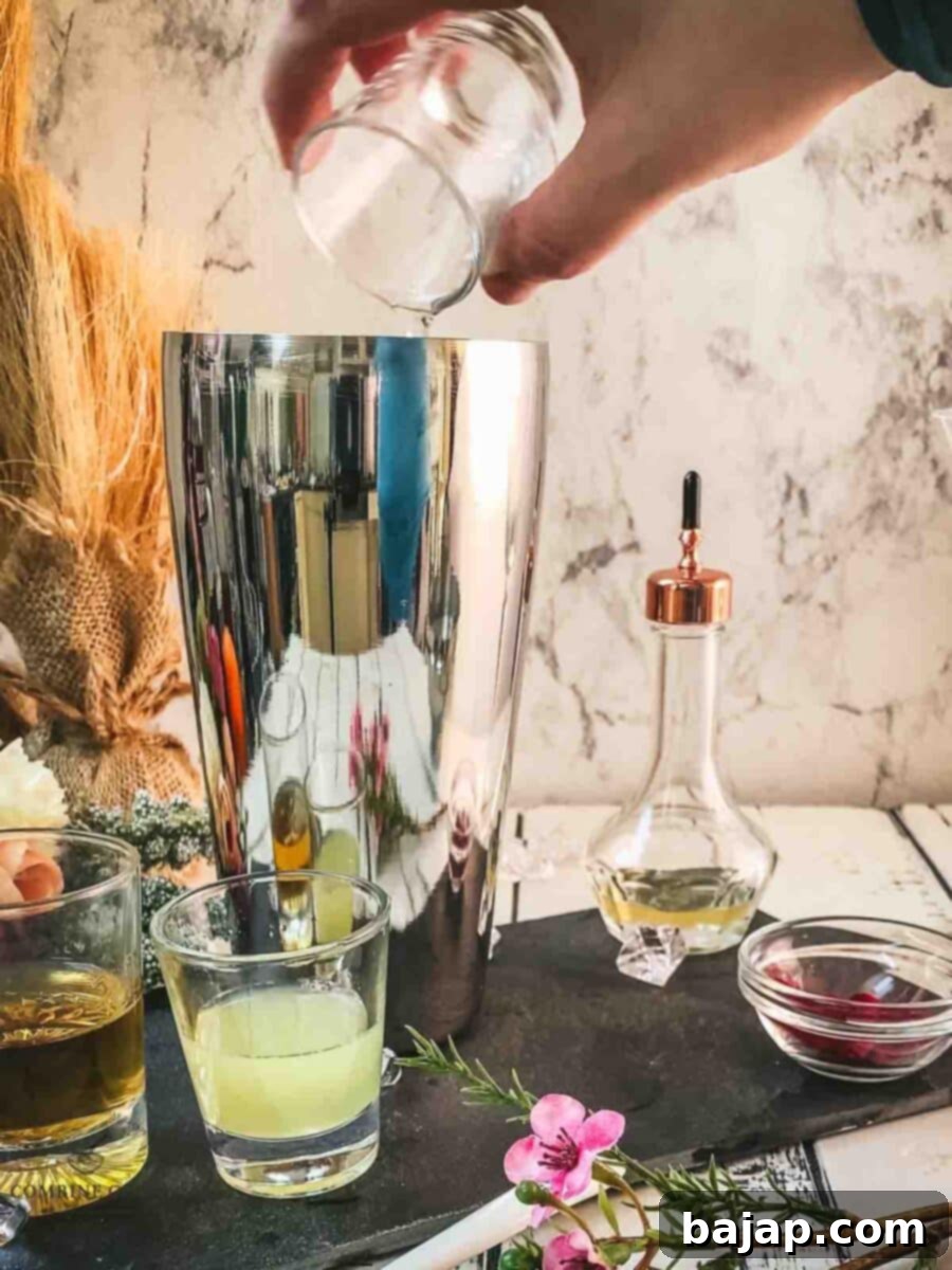 Add sugar syrup to the cocktail shaker.