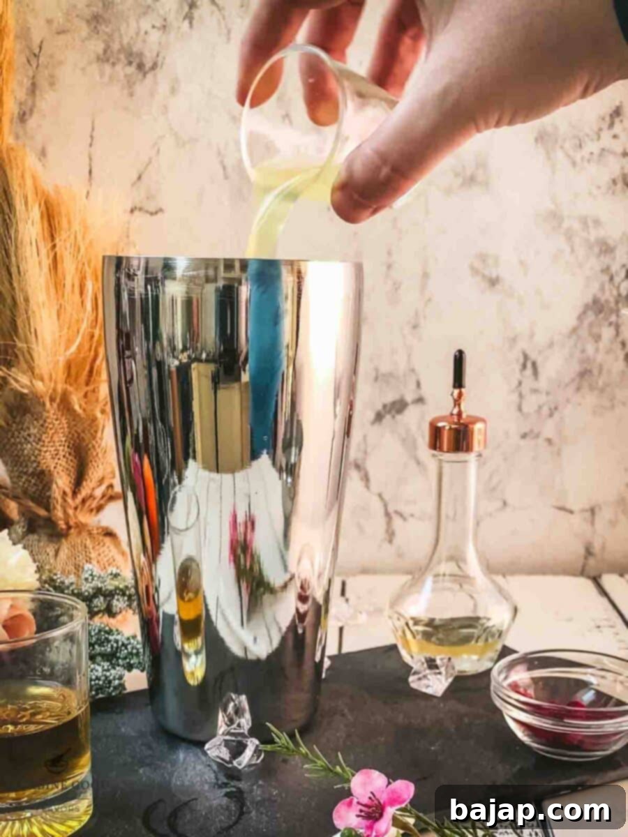Add freshly squeezed lemon juice to the cocktail shaker.