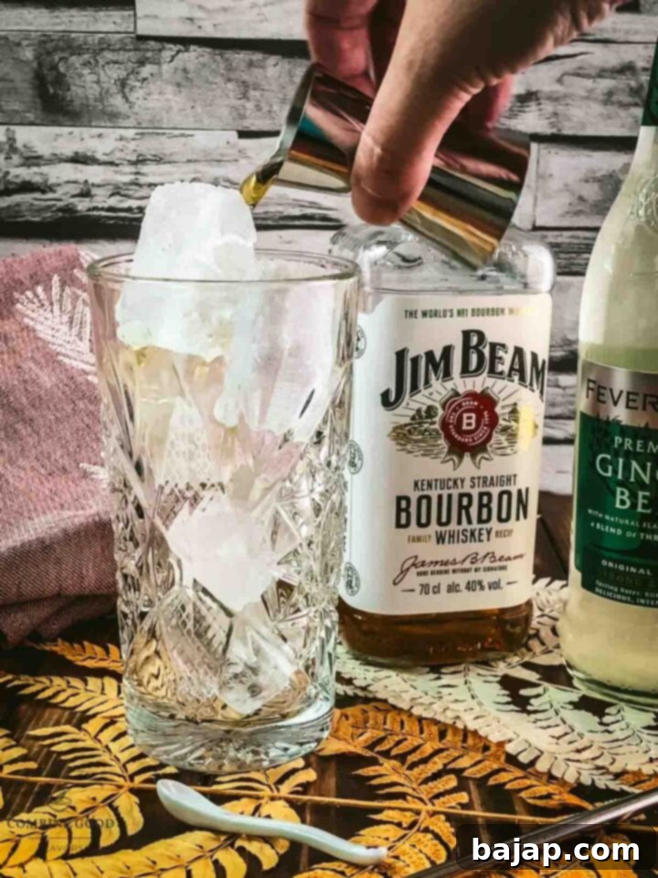 Pour smooth bourbon directly over the ice in the highball glass.