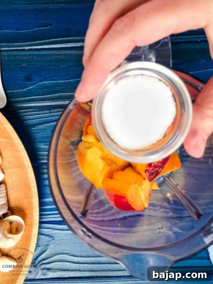 Golden Peach Purée: Perfect for Bellinis and Beyond 6 Adding sugar to the blender with peaches and lemon juice.