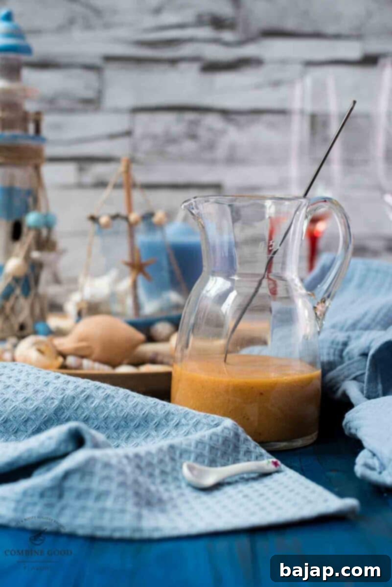 Golden Peach Purée: Perfect for Bellinis and Beyond 9 A glass jug filled with homemade peach puree, glistening and ready.