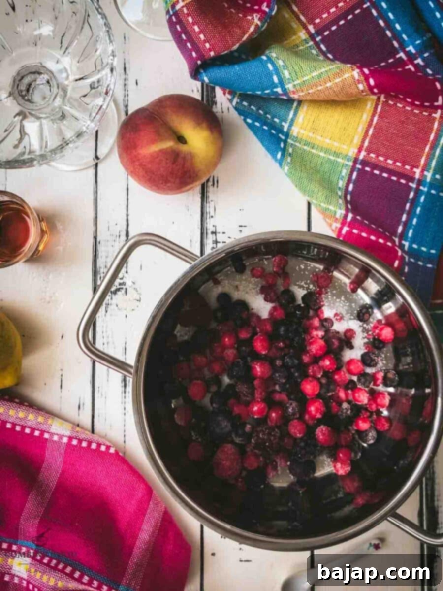 Add the frozen berries to the saucepan.