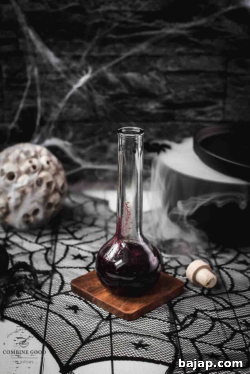 Easy 3-Ingredient Fake Blood 5 Eerily beautiful Halloween decorations, including cobwebs and a black, steaming cauldron, create the perfect backdrop for spooky treats.