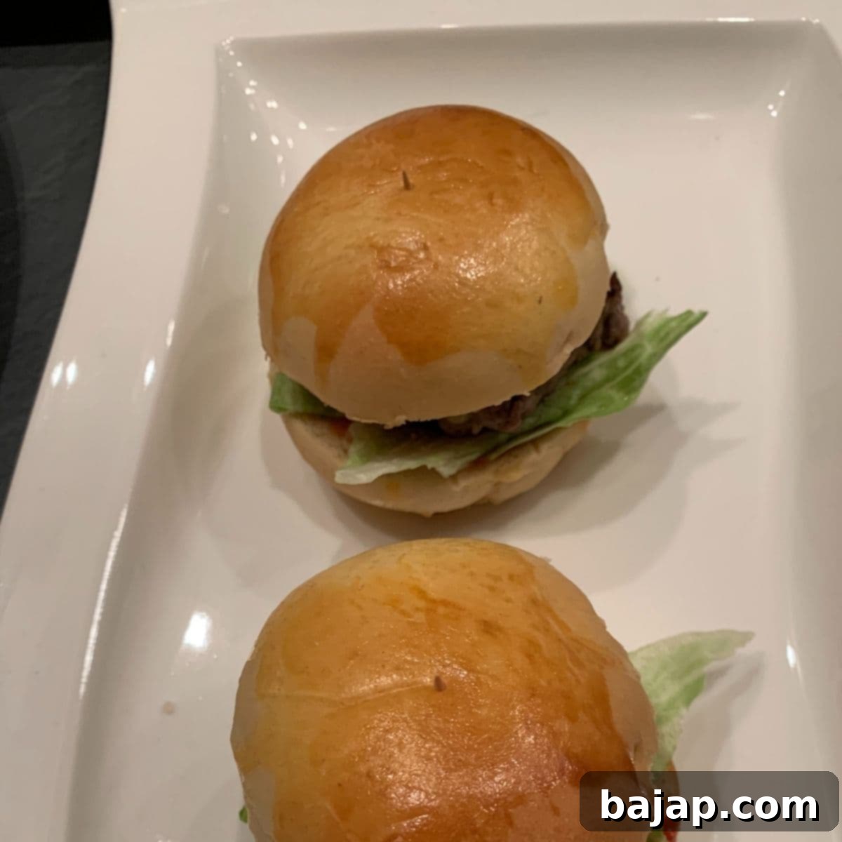 Homemade patties and buns assembled into perfect mini cheeseburgers.