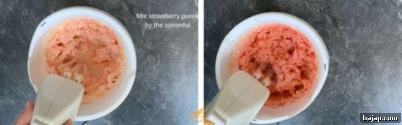 Mixing strawberry puree into buttercream frosting.