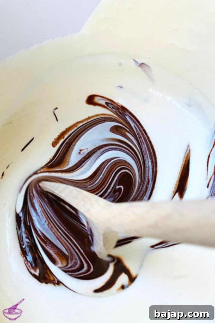 Layering the chocolate ricotta cream onto the Biscoff cookie base.