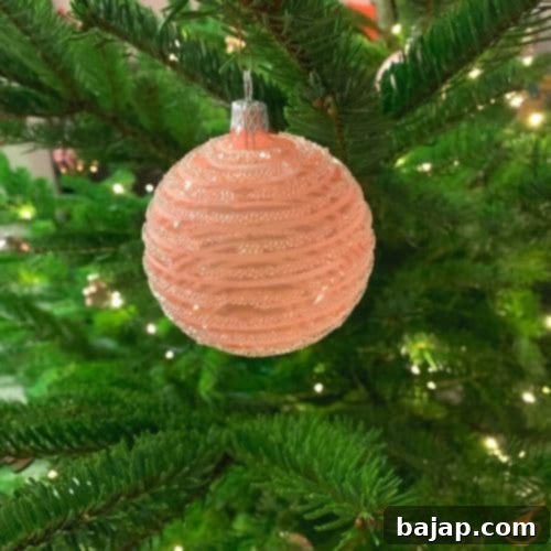 Displaying cherished Christmas ornaments with care.